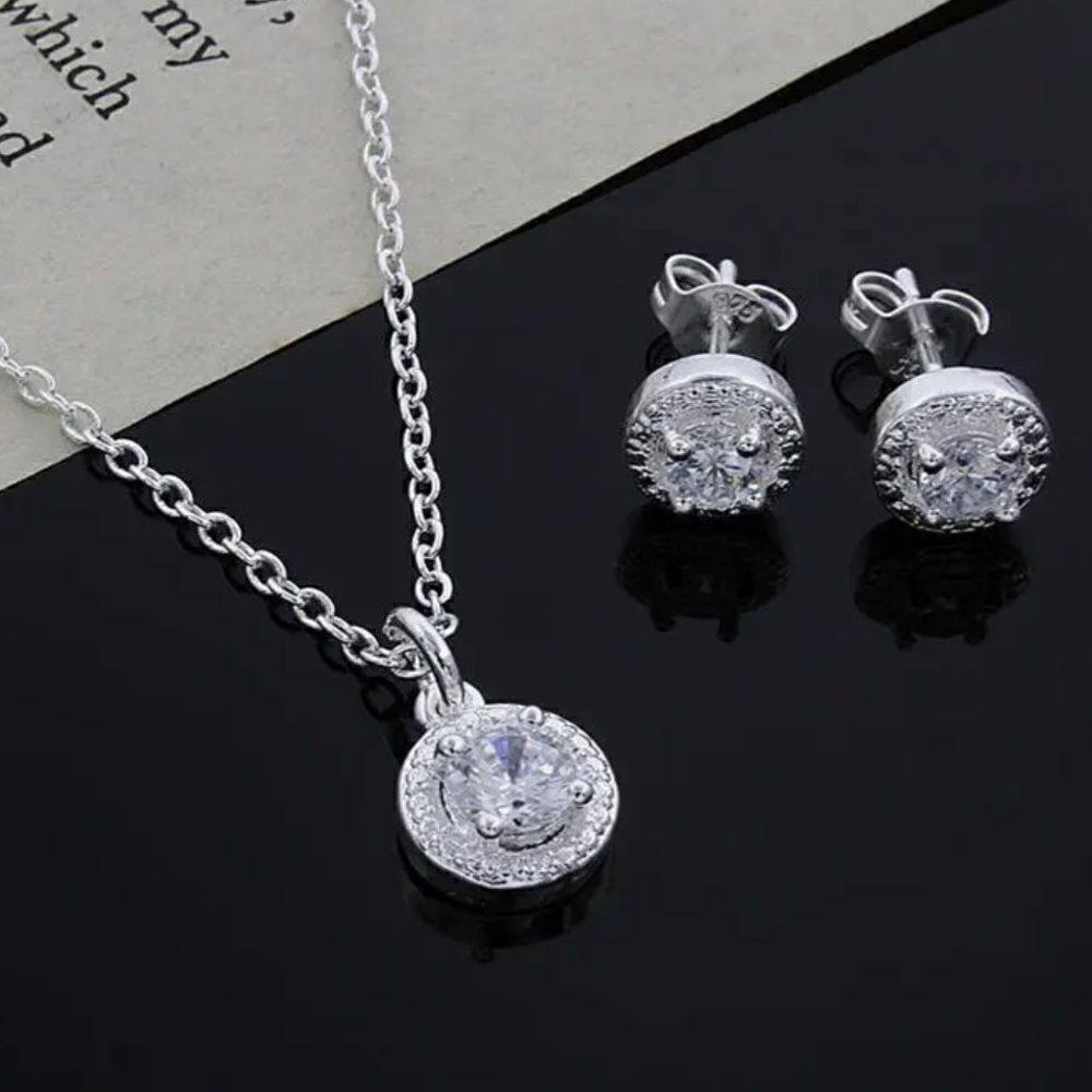 The Dainty Solitaire pendant necklace and stud earrings set in sterling silver
